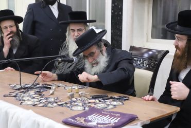 Rav Gamliel Rabinowitz at Chanukah Licht at 'Bayis Lepleitos' on First Night of Chanukah. He Then Led Dreidel and Distributed Gelt.