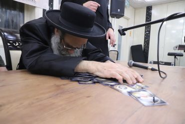 Rav Gamliel Rabinowitz at Chanukah Licht at 'Bayis Lepleitos' on First Night of Chanukah. He Then Led Dreidel and Distributed Gelt.